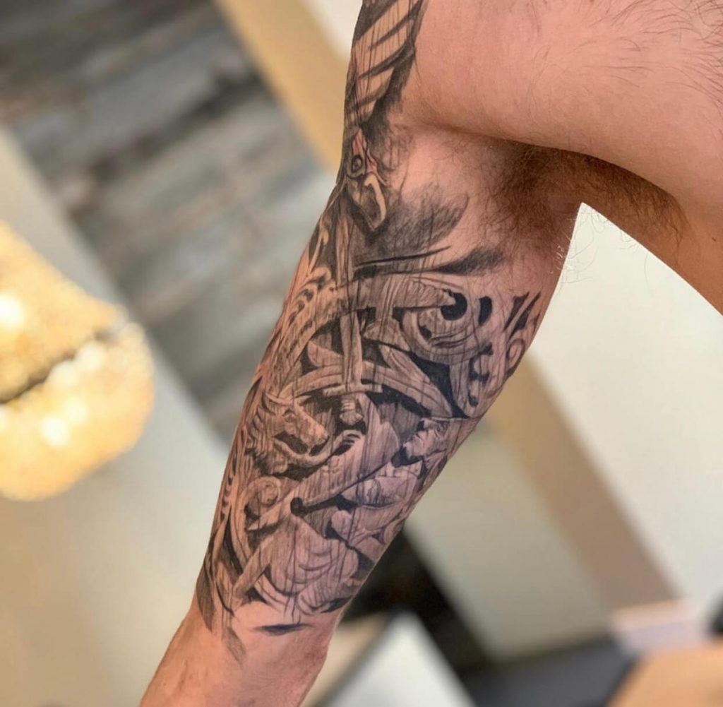 Norse wood carving tattoo by Kaireetattoo